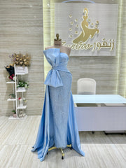 A flowing, sleeveless maxi dress in a soft, shimmering fabric, perfect for a summer evening